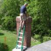 Inspecting chimney from the top.